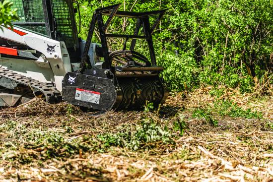 How to Clear Land With a Bobcat?